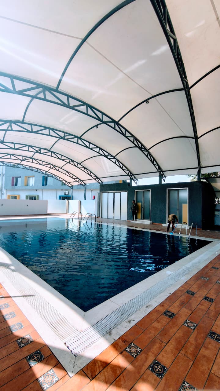 International-Grade Tensile Swimming Pool Pavilion: Riverdale World School, Raipur