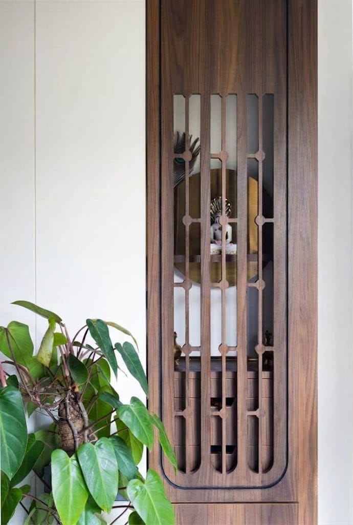 Traditional Wooden Pooja Room Design with Etched Glass Doors and Hanging Bells | Tambaram image 2