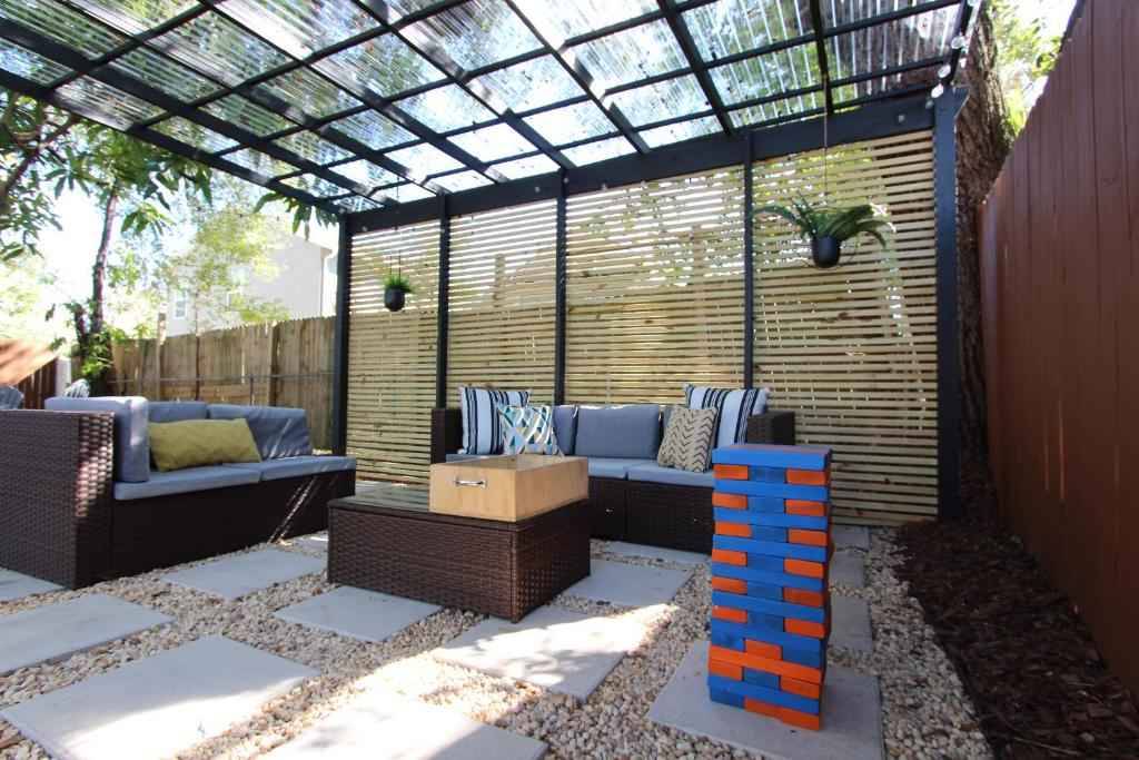 Modern Outdoor Pergola Seating Design with Polycarbonate Roof – Contemporary Landscape Design in Chennai image 2