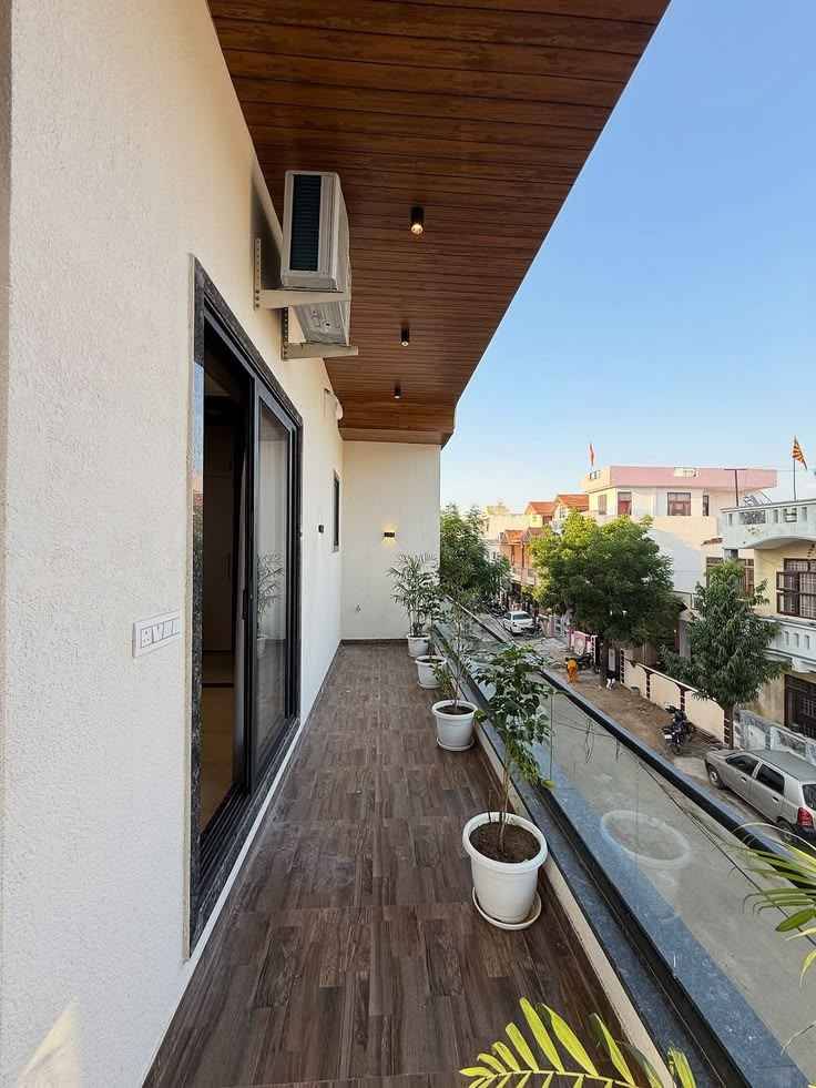 Urban Balcony Escape Wooden Deck Flooring And Panoramic Glass Railing | Anna Nagar  image 2