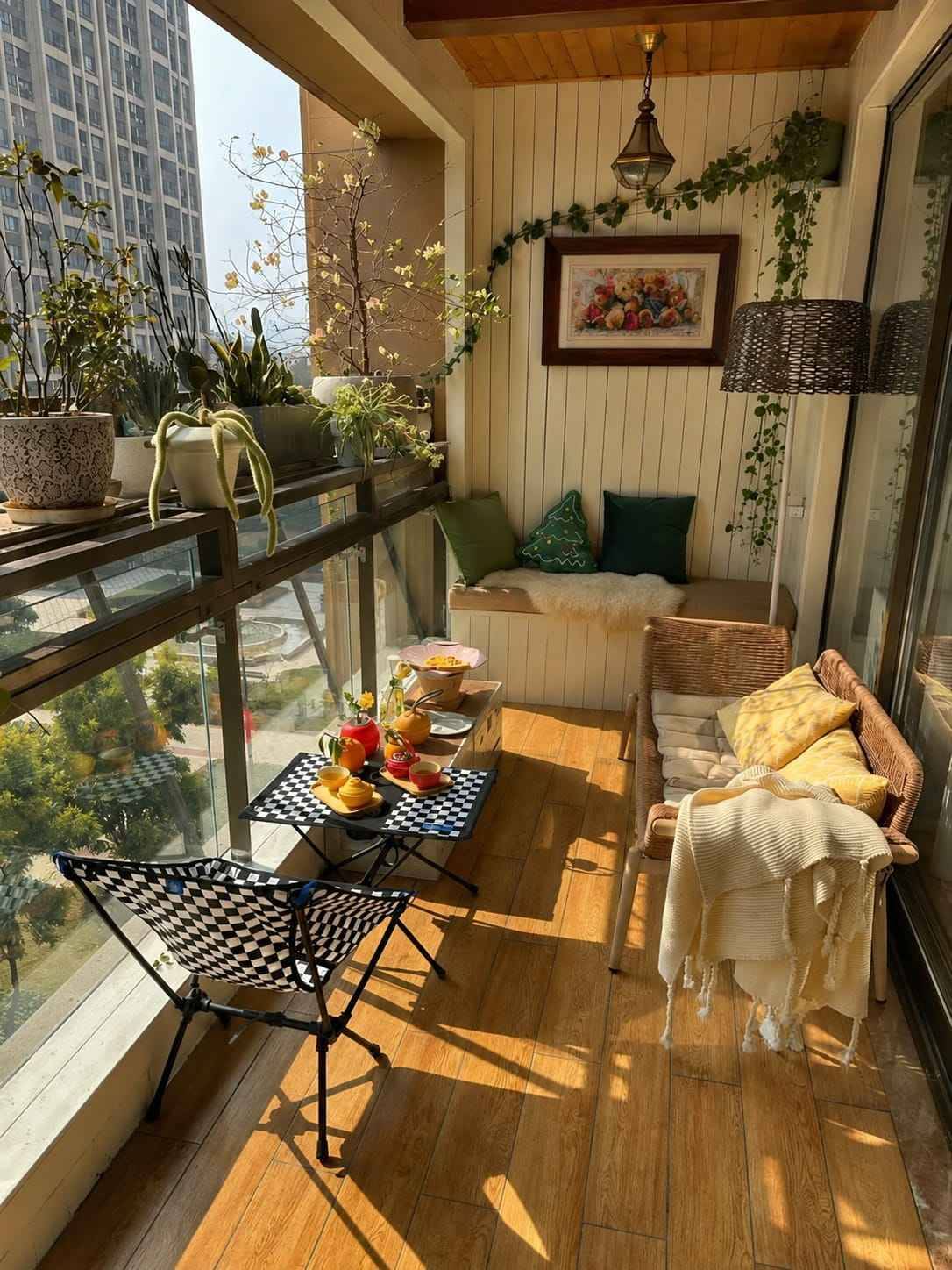 Elegant Balcony Garden Design with Wooden Deck and Glass Railing | Adyar image 2